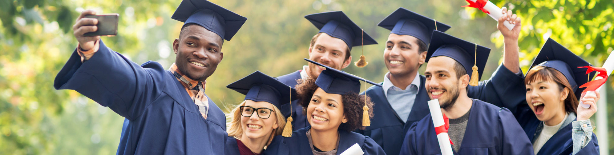 Graduates posing for a selfie.